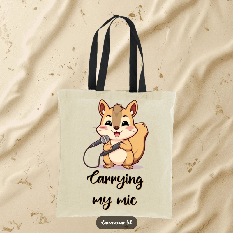 Funny squirrel, cheerful yet determined, holds a microphone boom ready for audio recording on a tote bag.